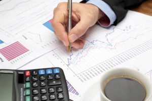 Paperwork and calculator on desk to represent tax planning